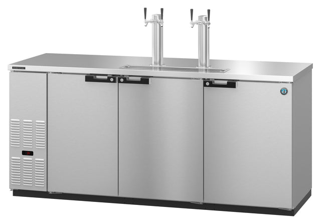 A commercial Stainless Steel Beer Cooler kegerator with three front doors, a digital control panel on the left, and two tall draft beer towers with dual taps on top. The flat countertop surface appears clean and reflective.