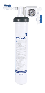 A white cylindrical water filter labeled Blueain Scale Inhibitor Filter is mounted vertically. Ideal for ice machine filtration, it features a pressure gauge, connector valves, and black cap, with text and specifications on the filter body.