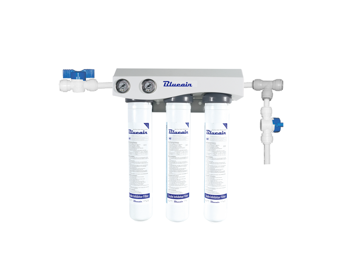 A wall-mounted Blueair triple filtration system with three vertical filter cartridges, labeled with instructions. Ideal for ice machine filtration and scale reduction, the unit features two pressure gauges and blue valve controls on white piping.