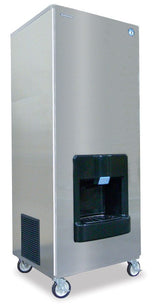 A tall, rectangular Hoshizaki DKM-500BAJ ice dispenser with a black Crescent Cube-Style dispensing area, a blue lever, and four wheels at the base showcases a modern, industrial look against a plain background.
