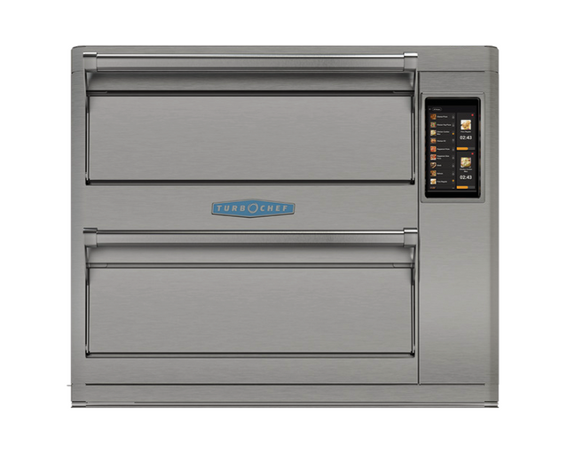 A sleek, industrial stainless steel TurboChef Double Batch Oven with two horizontal doors and a vertical digital touchscreen panel. This ventless countertop oven features menu icons, cooking times, and can accommodate a 16" pizza capacity.