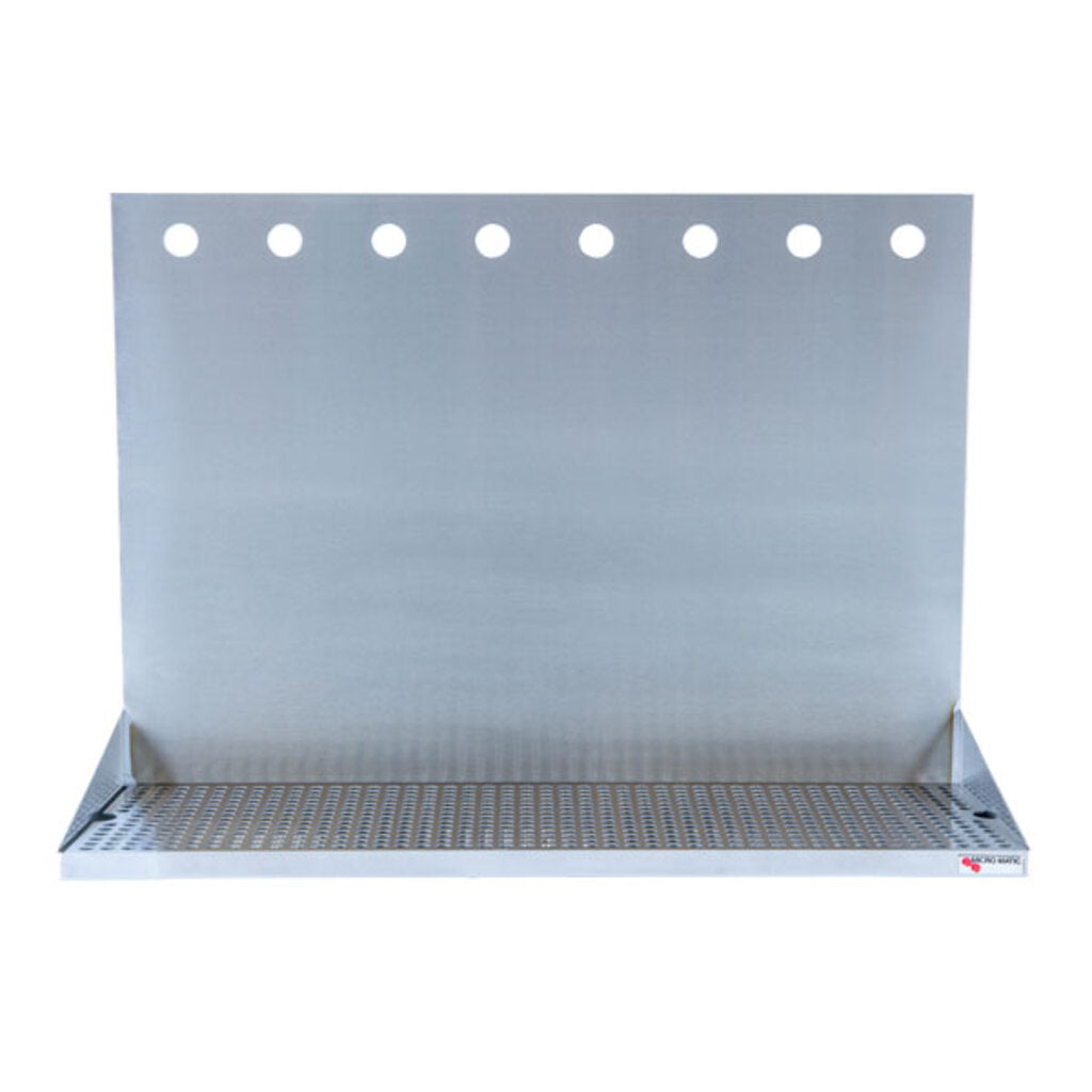 A Micro Matic USA stainless steel wall mount drain tray with a slotted surface and tall backplate featuring eight evenly spaced holes is designed for mounting on a wall, perfect for bar or beverage dispensing setups.