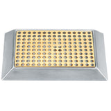 A rectangular stainless steel object with a yellow grid of circular holes sits within a silver, angled frame. Set against a white background, this industrial or kitchen tool is likely a grater or drip tray.
