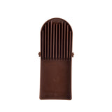 A brown plastic potato slicer with vertical slits and a handle, viewed from above on a white background. The simple, utilitarian design features evenly spaced slots for guiding a knife and is dishwasher safe for easy cleaning.