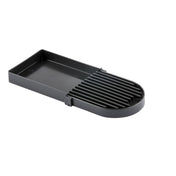 A black rectangular plastic slicer with parallel raised grooves and a half-rounded end. The left section is flat with raised edges, while the right has vertical slots for guiding slicing. This dishwasher safe tool is ideal for foods like eggs or mushrooms.