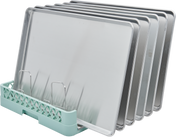 Five silver baking sheets are vertically organized in a Hobart rack with metal dividers. The light green rack base features an open lattice pattern, securely holding each sheet pan upright in a neat, evenly spaced manner against a white background.
