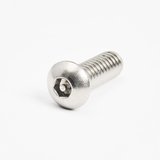 A shiny, silver metal screw with a rounded head and internal hexagonal (Allen) socket lies on a white surface. Commonly used in assembling commercial dishwasher units, the fully threaded shaft appears clean and unused.