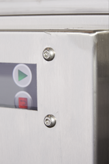 Close-up of a metallic control panel on a Hobart FT1000E flight type dish machine, featuring two screws and part of a display. The screen shows a green play button and red button, with the brushed metal surface indicating its robust, low energy design.