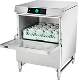 A commercial undercounter dishwasher with the front door open reveals a rack filled with white cups neatly arranged inside. The control panel at the top features a digital display and a large green start button. The machine stands on metal legs.