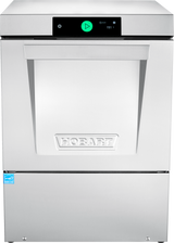 A front view of a stainless steel Hobart undercounter dishwasher. The machine features a large handle, smart touchscreen controls with a green power button, and a blue certification label on the lower left. The Hobart logo is embossed in the center.