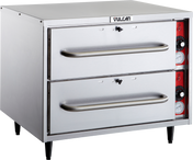 A commercial stainless steel double-deck oven with individual thermostat controls, two horizontal handles, control knobs, and temperature gauges on the right panel, labeled “Vulcan” at the top, standing on four black legs.