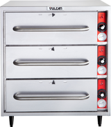 A free standing stainless steel Vulcan warming drawer unit with three horizontal drawers. Each drawer has a handle, and the right side features red control panels with knobs and temperature gauges for each warming drawer. The unit stands on four black legs.