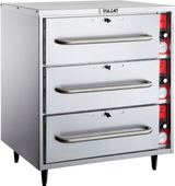 A free standing stainless steel commercial warming drawer unit with three horizontal drawers, each featuring a long handle. The right side displays red control panels with multiple knobs and dials. The Vulcan brand name is visible at the top front.