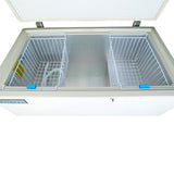 Top view of an open white chest freezer with a solid lid, showing two empty wire baskets inside. The clean silver interior is divided by a central compartment, and there’s a lock on the front—ideal for any commercial kitchen freezer setup.