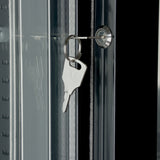 A silver key is inserted into a lock on an Empura refrigeration back bar cooler with sliding glass doors. The key, attached to a metal ring, reflects clearly on the glass beside the sleek black door frame.