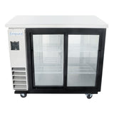 A back bar cooler featuring Empura refrigeration, this commercial unit has a white top, two sliding glass doors, wire shelves inside, and a white and black exterior. The left side includes a vent, digital display, label, and four wheels for mobility.