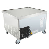 An Empura refrigeration stainless steel refrigerated equipment stand with a flat top, side ventilation panels, exposed electrical components and cord at the back, caster wheels for mobility, plus information labels and warning stickers on the side.