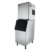 A commercial stainless steel cube-style ice maker with a tall rectangular shape, vented upper ice machine unit for production, and a lower commercial ice bin with a black slanted lid, all raised on four adjustable legs. The Empura logo appears on both sections.