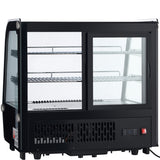 A black Empura refrigeration countertop display case with glass panels on all sides, two sliding glass doors at the front, two metal shelves inside, and a vented lower section. A digital temperature display and control buttons are visible on the bottom right.