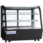 A black and glass Empura refrigeration countertop display refrigerator with two wire shelves and interior LED lighting. The curved glass front and blue and white Empura logo create a modern, sleek refrigerated display case for any setting.