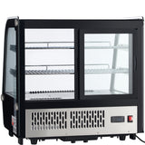A black and silver Empura refrigerated case with glass panels, two sliding doors, three metal wire shelves, and a vented stainless steel base featuring a digital temperature display and control switch on the lower right.