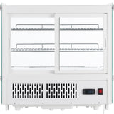 A countertop-sized Empura refrigeration display case with two sliding glass doors, two interior wire shelves, side glass panels, and a digital temperature display. Ventilation grilles are on the bottom for cooling. The refrigerated display case is empty.