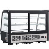 A black and silver Empura refrigerated display countertop case with glass panels on all sides, two metal shelves inside, a vented base, digital temperature display, and power switch. The front features sliding glass doors for easy access to the interior shelves.