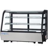 A commercial Empura refrigerated display case with a glass front and sides, two wire shelves, and a stainless steel base. The well-lit countertop display case is perfect for showcasing food items while keeping them fresh.