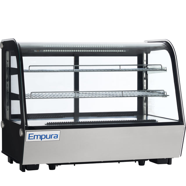 A commercial Empura refrigerated display case with a glass front and sides, two metal wire shelves, black frame, and stainless steel base. The well-lit countertop display case is empty, showcasing the Empura brand on the front.