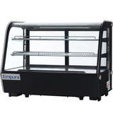 A black, rectangular Empura refrigerated display case with curved glass front and sides, two metal wire shelves, and interior LED lighting. This countertop display case is perfect for showcasing food items while keeping them fresh.