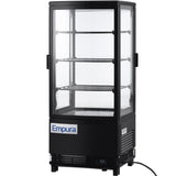 A black Empura E-RDC-17B-2D countertop display refrigerator with glass panels on all sides, three adjustable wire shelves, and a digital temperature display at the bottom. The refrigerated display case is plugged in and empty inside.