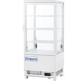 A white Empura refrigeration countertop display refrigerator with glass sides and door, three wire shelves, and a digital temperature display near the base showing 3.9°C. The refrigerated display case stands on small feet and is empty.