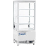A white Empura countertop display refrigerator with a glass door and three adjustable wire shelves. Featuring Empura refrigeration, this see-through refrigerated display case has a digital temperature display and a vented base for optimal showcasing.
