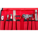 A red fabric case holds an eight-piece garnish set, including a zester, melon baller, channel knife with ergonomic handle, peeler, double-wheel pastry cutter, corer, and two other utensils—each in its own pocket against a red background.