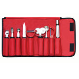 A red roll-up garnish set containing eight kitchen tools, each with ergonomic handles in red or metal, including a zester, melon baller, and more—all neatly arranged in individual slots.