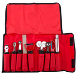 A red fabric case with nine pockets holds a garnish set of kitchen tools, including peelers, zesters, a pizza cutter with ergonomic handle, and a grater. The case is open, displaying all utensils neatly organized with black trim and a top flap.
