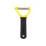 A black-handled julienne peeler with a yellow frame and serrated stainless steel blade is shown against a white background. The ergonomic handle, labeled "FIRM GRIP," features a hole for hanging and is dishwasher safe.