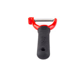 A Y peeler with a horizontal stainless steel blade, red frame, and black textured ergonomic handle is centered on a white background. The brand name “Farberware” is embossed on the handle.