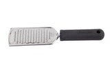 A stainless steel handheld grater with a flat, rectangular grating surface featuring small holes and a black, ergonomic handle labeled FIRM GRIP. The handle has a hole at the end for hanging.