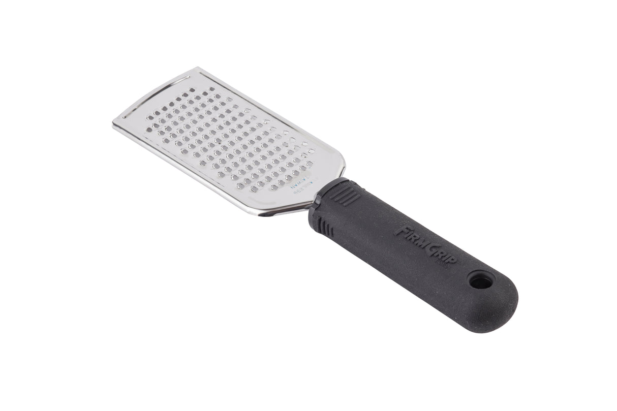 A stainless steel hand grater with a rectangular grating surface and an ergonomic, black textured plastic handle. The handle has a hole at the end for hanging. The grater is positioned diagonally on a white background.