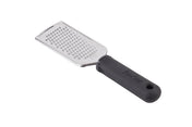 A stainless steel hand grater with a rectangular grating surface and an ergonomic, black textured plastic handle. The handle has a hole at the end for hanging. The grater is positioned diagonally on a white background.