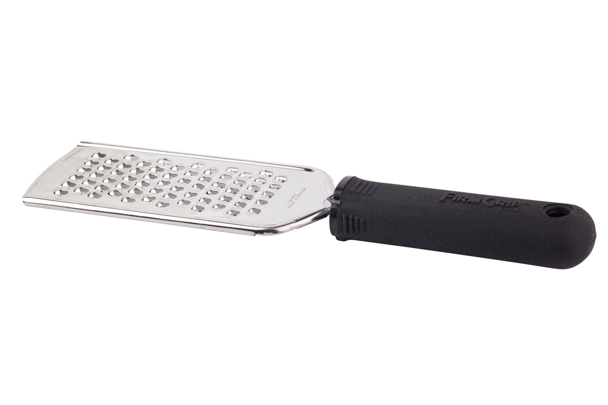 A metal handheld FirmGrip Grater featuring a rectangular stainless steel grater surface and an ergonomic handle labeled “FIRM GRIP.” The black rubberized handle has a hole for hanging, while sharp raised holes make grating food effortless.