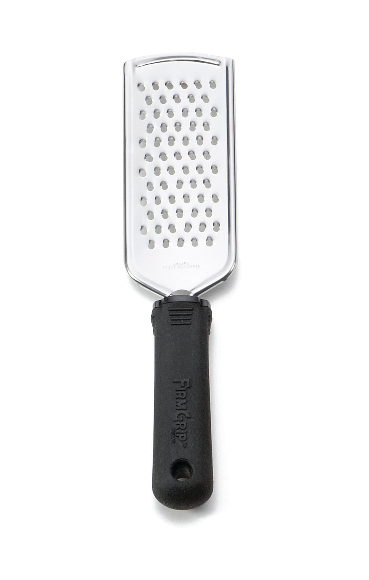 A stainless steel grater with a rectangular surface featuring medium-sized holes and an ergonomic handle with a textured grip. The handle, embossed with the Farberware name, offers comfort and control—perfect as your FirmGrip Grater.