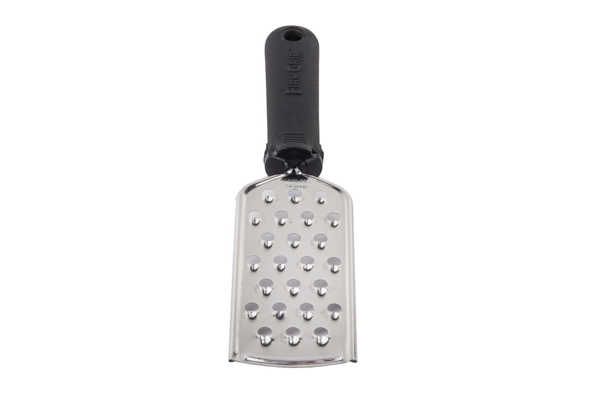 A handheld FirmGrip Grater with an ergonomic soft grip handle. This stainless steel grater features large, round holes and a slightly curved, rectangular blade. The black handle includes a hole at the top for hanging. Background is white.
