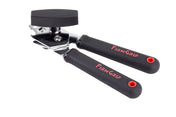 A FirmGrip Hand Can Opener with black, textured handles labeled “FIRM GRIP” in red letters. This ergonomic can opener has a large black turning knob, a cutting wheel, and red holes on the handles for hanging. The background is white.