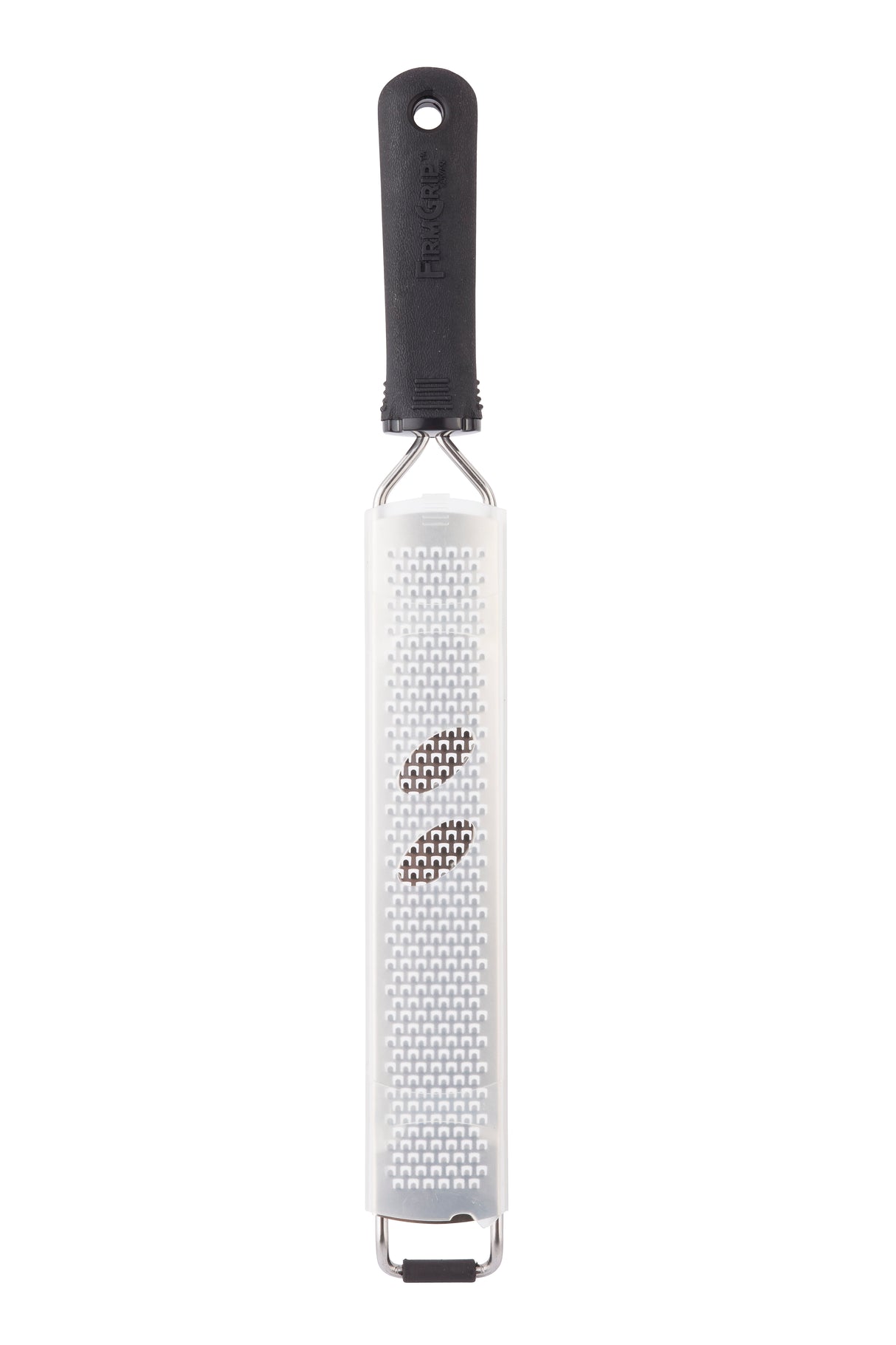 A Microplane Grater with an ergonomic handle is shown vertically on a white background. Two whole nutmeg seeds rest on its sharp, small holes for fine grating. The rectangular, flat grater is also dishwasher safe for easy cleaning.
