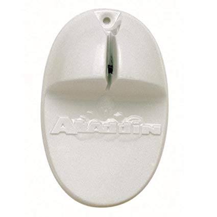 Oval-shaped white plastic object with a notch at the top and a raised section in the center. The word Aladdin is embossed below the raised area, identifying it as a FirmGrip Aladdin Knife Sharpener by TableCraft. Small hole near top for hanging.