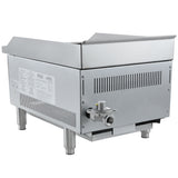 A commercial stainless steel countertop charbroiler with vented sides, raised back and side splash guards, a front control valve, and sturdy cylindrical legs. Manufacturer labels and safety instructions are visible on the left side.