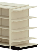 A beige metal Kent Unlimited retail store display shelving unit with four horizontal shelves and a perforated pegboard back, set on a black base. The shelves are empty and the unit is shown against a plain white background.
