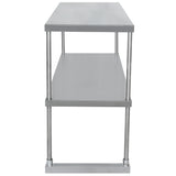A stainless steel table with two flat shelves and four round legs. The image shows the table from the narrow end, highlighting its rectangular shape, simple industrial design, and a convenient overshelf between the tabletop and the base.